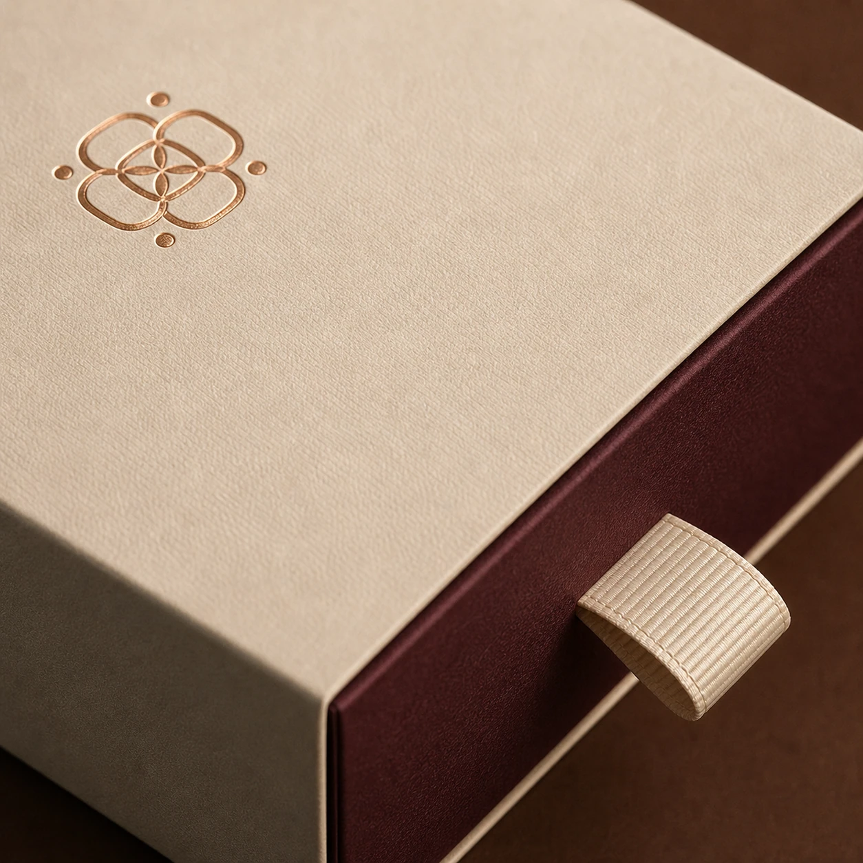 Close detail of foil, sleeve and ribbon pull